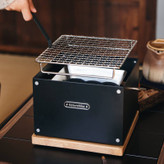 گریل رومیزی زغالی نیچرهایک مدل CNK2300CF010 در حال پخت گوشت در طبیعت